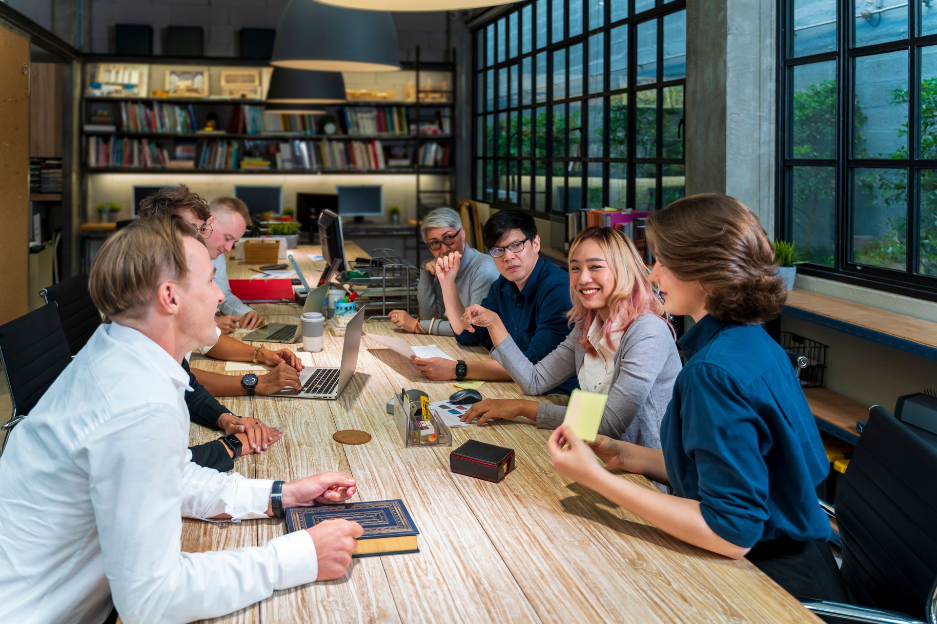 Group of young energetic diversity classmate students brainstorming together with professor in workshop for class final project using teamwork effort for university education and business meeting concept